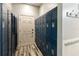 Locker room showcasing rows of blue lockers and clean, modern design elements at 428 Islebay Dr, Apollo Beach, FL 33572
