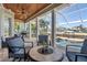Covered outdoor seating area overlooking the canal and pool, ideal for enjoying waterfront living at 428 Islebay Dr, Apollo Beach, FL 33572