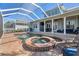 Backyard featuring a pool, spa, and covered patio, perfect for outdoor entertaining and relaxation at 428 Islebay Dr, Apollo Beach, FL 33572