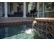Beautiful pool featuring a tiled edge with a cascading water feature at 428 Islebay Dr, Apollo Beach, FL 33572