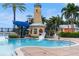 Enjoy the community pool featuring a lighthouse slide and a tanning ledge for ultimate relaxation at 428 Islebay Dr, Apollo Beach, FL 33572