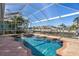 Stunning waterfront home featuring a screened pool and spa with private dock access to a serene canal at 428 Islebay Dr, Apollo Beach, FL 33572