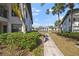 Scenic backyard view showcases a tranquil path and lush greenery, highlighting the property's serene setting at 4330 47Th W Ave # 104, Bradenton, FL 34210