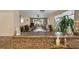 The dining area showcases a glass table, wicker chairs, and views of the living room at 4330 47Th W Ave # 104, Bradenton, FL 34210