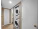 Efficient laundry area with stacked washer and dryer units conveniently located near the bathroom at 4330 47Th W Ave # 104, Bradenton, FL 34210