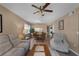 View of the open floor plan in the living and dining areas with neutral color tones and tile flooring at 4330 47Th W Ave # 104, Bradenton, FL 34210