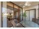 Outdoor patio with seating area overlooking the living room with sliding glass doors to enjoy the view at 4330 47Th W Ave # 104, Bradenton, FL 34210