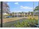 Charming pond view featuring tranquil waters with a fountain, surrounded by well-manicured lawns and condo buildings at 4330 47Th W Ave # 104, Bradenton, FL 34210