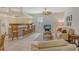 Bright living room featuring tile floors, kitchen breakfast bar, and a neutral color palette at 436 Country Ln, Bradenton, FL 34212