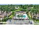 Aerial view of a townhouse with a private pool, parking and landscaping at 4790 Turnberry Cir, North Port, FL 34288