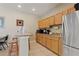 Clubhouse kitchenette featuring granite counters and stainless steel appliances at 4790 Turnberry Cir, North Port, FL 34288