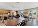 Spacious clubhouse interior with tables, chairs, and a functional kitchenette at 4790 Turnberry Cir, North Port, FL 34288