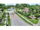 Gated community entrance, with tropical landscaping and beautiful water feature in the background at 4790 Turnberry Cir, North Port, FL 34288