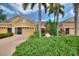 Charming single-Gathering home with well-maintained landscaping and a brick driveway at 4790 Turnberry Cir, North Port, FL 34288