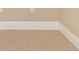 Close up image of the tile flooring and white trim at 4790 Turnberry Cir, North Port, FL 34288