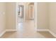 Bright and airy foyer with tile flooring, leading to view of the rest of the home at 4790 Turnberry Cir, North Port, FL 34288