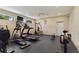 Community gym with modern cardio equipment, weight machines, and large mirrors at 4790 Turnberry Cir, North Port, FL 34288