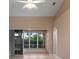 Living room with high ceilings, lots of light, neutral wall color and tiled flooring at 4790 Turnberry Cir, North Port, FL 34288