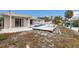 Backyard featuring a pool, patio, waterfront access, and deck in need of repair at 507 59Th St, Holmes Beach, FL 34217