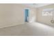 Bedroom with window and ensuite bathroom with blue paint at 507 59Th St, Holmes Beach, FL 34217
