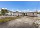 Exterior view of the home with an attached garage and a concrete driveway at 507 59Th St, Holmes Beach, FL 34217