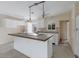 Kitchen with a tiled island and white cabinets at 507 59Th St, Holmes Beach, FL 34217