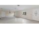Spacious living room with a front door, chandelier, and a window with view to the front at 507 59Th St, Holmes Beach, FL 34217
