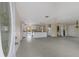 Open floor plan featuring a kitchen with breakfast bar and an adjacent outdoor pool at 507 59Th St, Holmes Beach, FL 34217