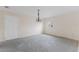Empty living room with a chandelier and a door to the outside at 507 59Th St, Holmes Beach, FL 34217