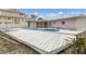 Backyard pool area, featuring a uniquely shaped pool, patio, and waterfront access at 507 59Th St, Holmes Beach, FL 34217