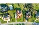 Aerial view of a landscaped home highlighting the driveway, manicured lawn, and neighborhood at 6107 Glen Abbey Ln, Bradenton, FL 34202