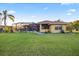Spacious backyard with screened patio/pool, ideal for outdoor entertaining at 6107 Glen Abbey Ln, Bradenton, FL 34202