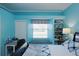 Bright bedroom with a window seat and built-in shelves, perfect for storage and a cozy reading nook at 6107 Glen Abbey Ln, Bradenton, FL 34202