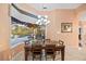 Stylish dining room with a large window view to the pool and backyard, offering a great view at 6107 Glen Abbey Ln, Bradenton, FL 34202