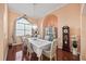 Charming dining room featuring a chandelier, large window, and classic decor for elegant meals at 6107 Glen Abbey Ln, Bradenton, FL 34202