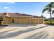 Spacious three car garage, offers ample parking and storage, a long driveway and well-manicured landscaping at 6107 Glen Abbey Ln, Bradenton, FL 34202