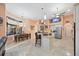 Spacious kitchen with stainless steel appliances, center island, breakfast bar, and tile flooring at 6107 Glen Abbey Ln, Bradenton, FL 34202
