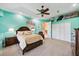 Comfortable main bedroom with tray ceilings and a private en-suite bathroom provides a retreat at 6107 Glen Abbey Ln, Bradenton, FL 34202