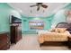 Spacious main bedroom with a tray ceiling, window seat, and beautiful view of the surrounding landscape at 6107 Glen Abbey Ln, Bradenton, FL 34202