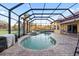 A sparkling pool and lush landscaping make this backyard oasis perfect for relaxation at 6107 Glen Abbey Ln, Bradenton, FL 34202