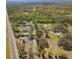 Aerial view of a house with oversized lot in a neighborhood of mature trees and a nearby highway at 7018 13Th E Ave, Bradenton, FL 34208