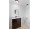 Bathroom featuring a vanity with drawers, mirror, and a toilet with white tile floors at 7018 13Th E Ave, Bradenton, FL 34208