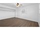 Bedroom featuring hardwood floors, natural light, closet space, and neutral paint colors at 7018 13Th E Ave, Bradenton, FL 34208