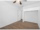 Inviting bedroom with hardwood floors, ceiling fan, and a closet for storage at 7018 13Th E Ave, Bradenton, FL 34208