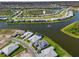 Breathtaking aerial view of waterfront homes and neighborhood near a tranquil lake at 7928 Redonda Loop, Bradenton, FL 34202