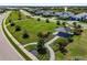 Aerial view of a park with a gazebo, lush landscaping, and sidewalks at 7928 Redonda Loop, Bradenton, FL 34202