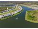 Gorgeous aerial view of the lakefront homes with manicured lawns, and neighborhood at 7928 Redonda Loop, Bradenton, FL 34202