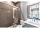Sleek bathroom with a tiled shower, vanity, and modern fixtures at 7928 Redonda Loop, Bradenton, FL 34202