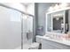 Bathroom with a glass-enclosed shower, vanity, and a neutral color palette at 7928 Redonda Loop, Bradenton, FL 34202