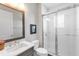 Modern bathroom featuring a glass-enclosed shower with white subway tile, a granite vanity, and chrome fixtures at 7928 Redonda Loop, Bradenton, FL 34202